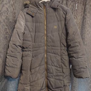 Girls winter coat by Calvin Klein. Size large and gray in color with faux fur.